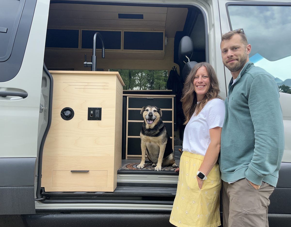 Jesse and Kailey Graver with their dog at their off-grid campervan